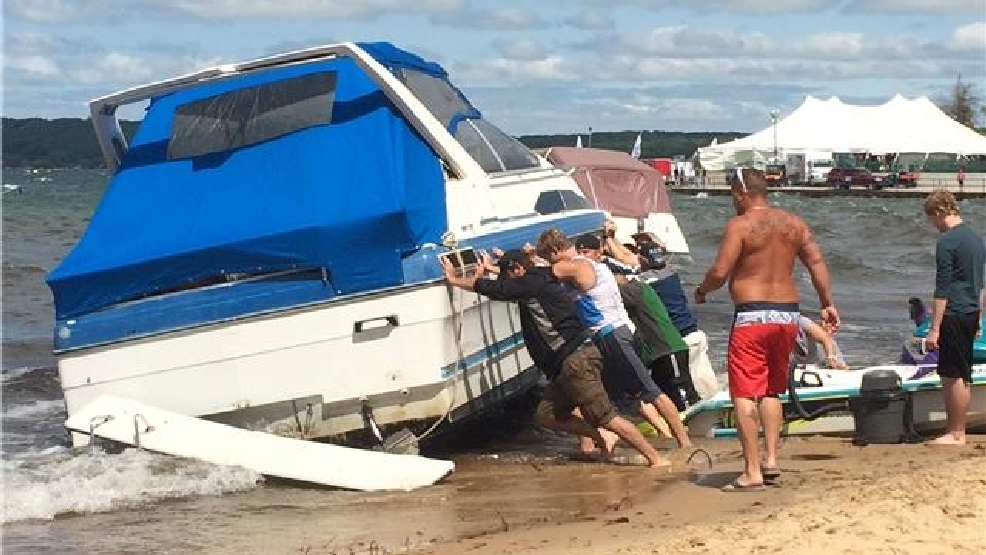 Boats damaged after being washed ashore at Grand Traverse Bay WPBN