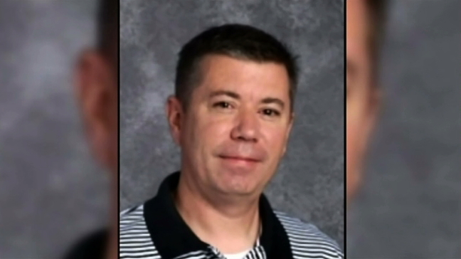 A Maize high-school teacher has been arrested