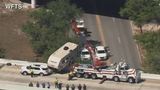 WATCH: Crews pull dangling camper from Florida overpass